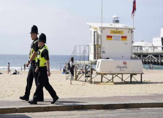 Boy arrested after woman stabbed to death on beach