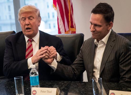 Peter Thiel says, 'If you hold a gun to my head I'll vote for Trump' though he isn't backing campaign