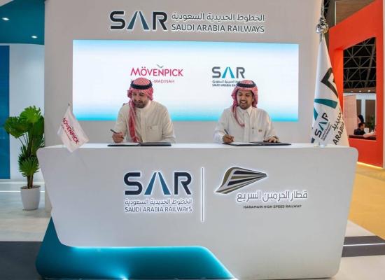  Participants in the Hajj and Umrah Exhibition witness the signing ceremony of Anwar Al Madinah Mövenpick Hotel agreement with Saudi Arabia Railways - SAR 