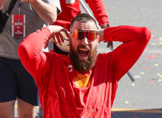 Travis Kelce receives his University of Cincinnati diploma, chugs a beer on stage