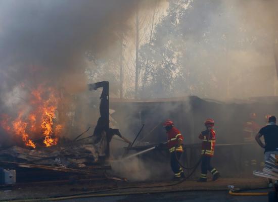 Three firefighters die as Portugal battles dozens of wildfires